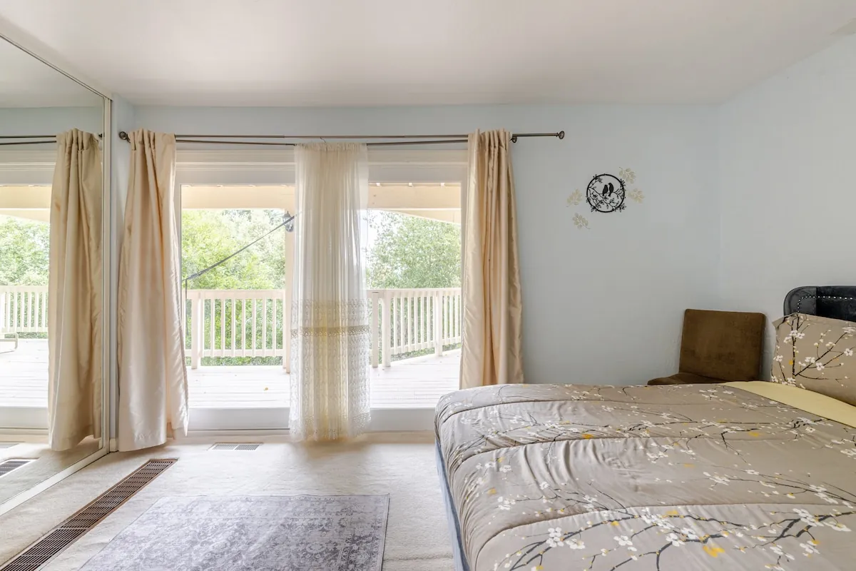 Bedroom with private deck and garden view
